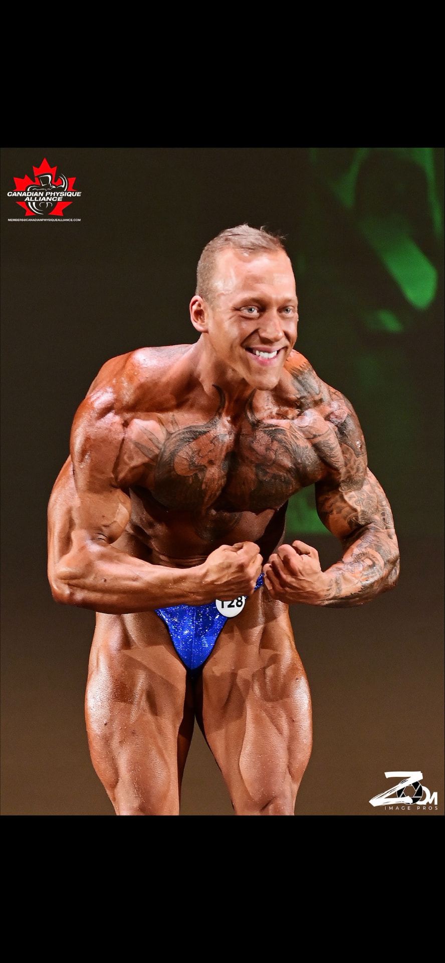Colton Britzius hitting a most-muscular pose on the same stage