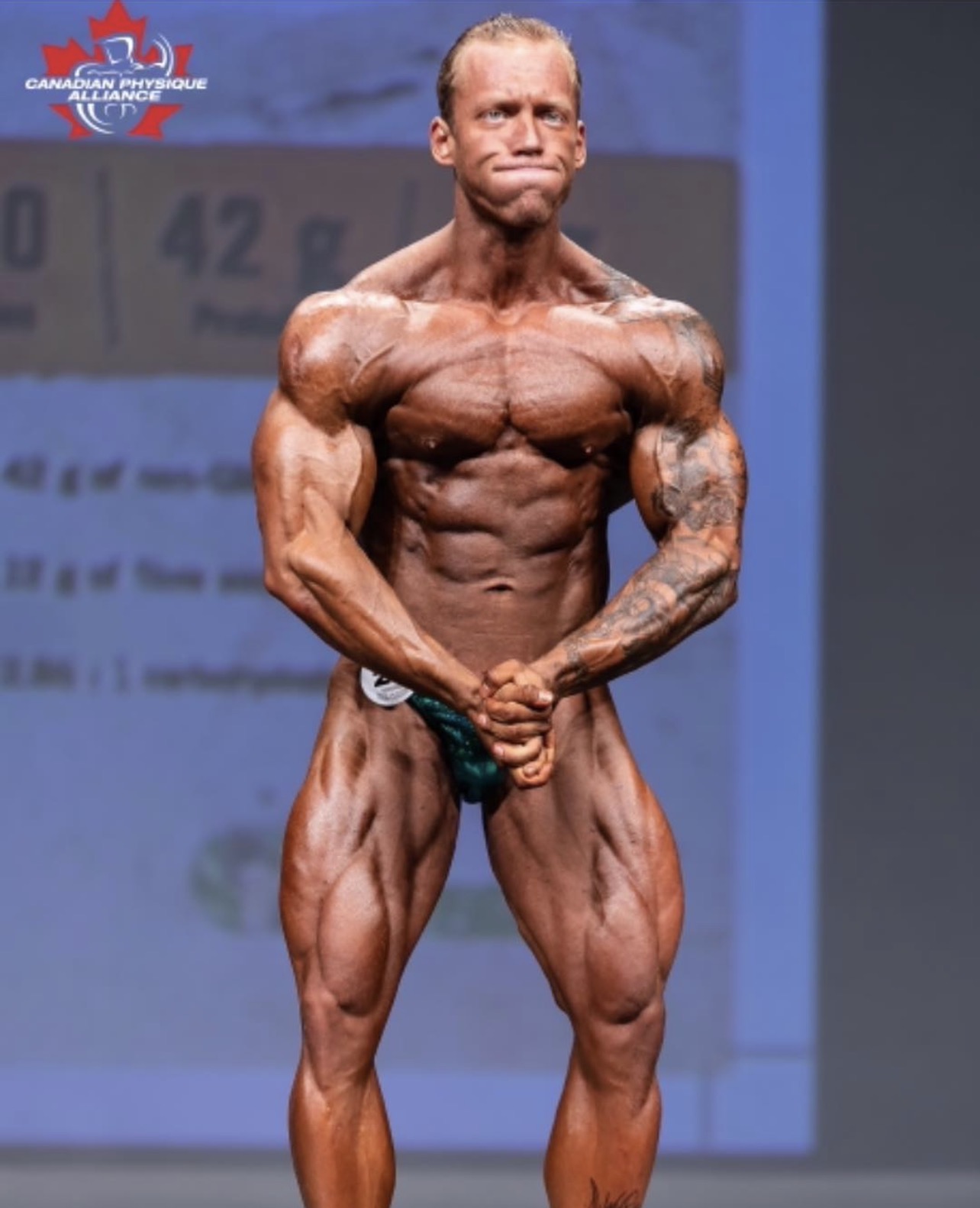 Colton Britzius on the Canadian Physique Alliance stage in 2018, where he placed third