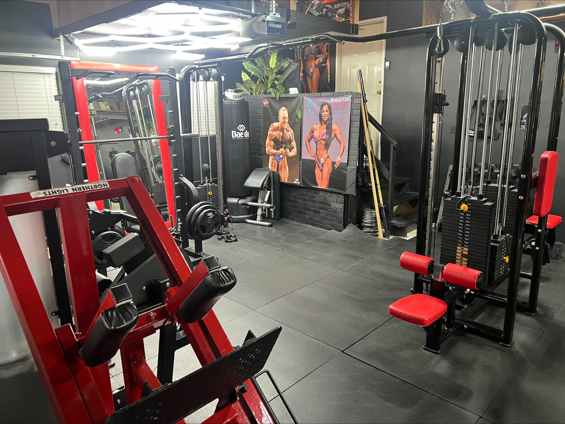 Inside Colton's private training gym — machines, racks and plate-loaded stations